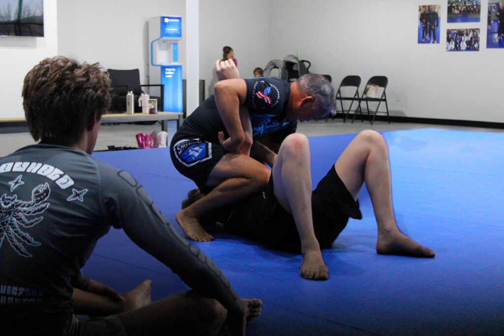 coach ty teaching bjj, demonstrating on student