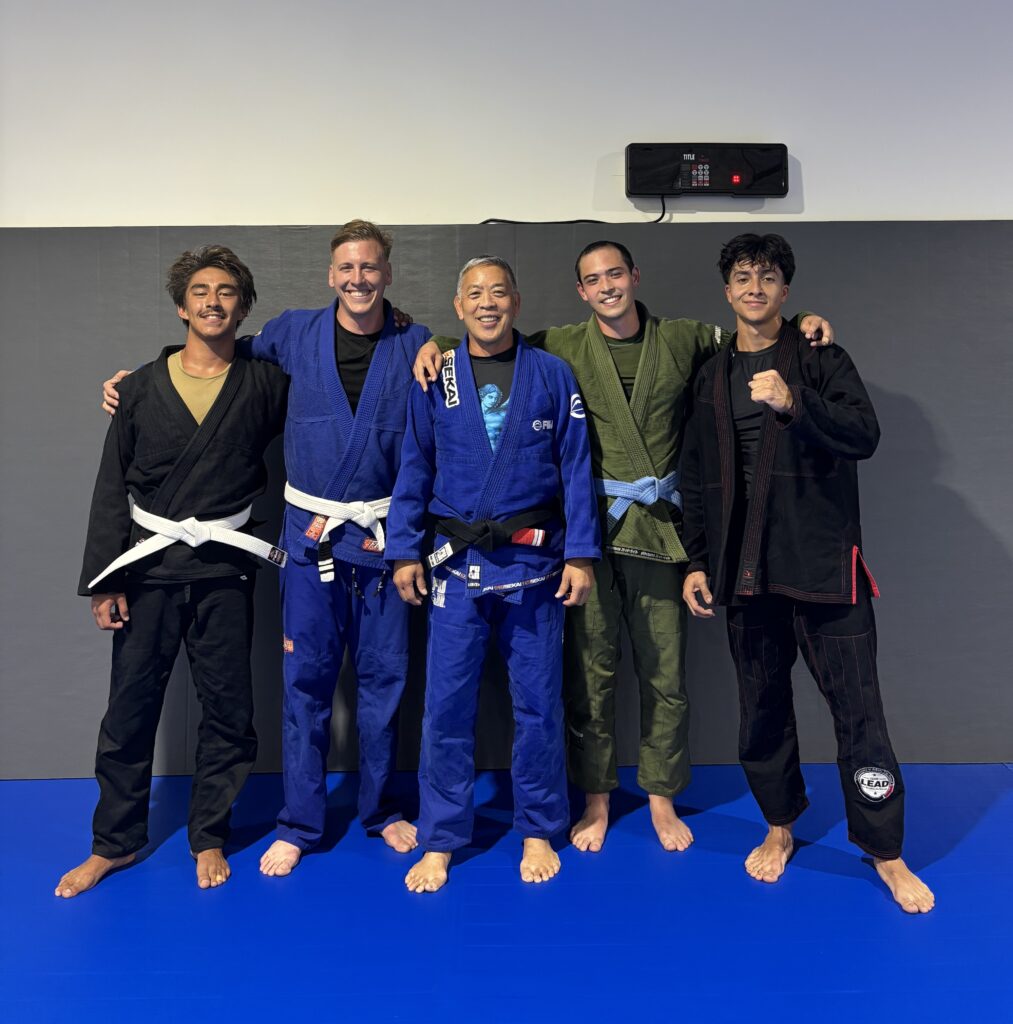 students in bjj gis at their gym